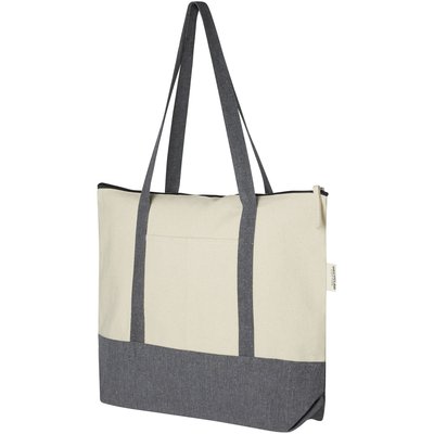 De Repose-draagtas met ritssluiting is gemaakt van eco-vriendelijk, pre-consumer gerecycled katoen van 320 g/m². Heeft een hoofdcompartiment met ritssluiting, trendy kleurblokken, steekvak aan de voorkant en handgrepen van 27 cm. Geschikt tot 10 kg gewicht.