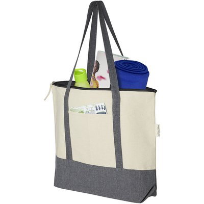 De Repose-draagtas met ritssluiting is gemaakt van eco-vriendelijk, pre-consumer gerecycled katoen van 320 g/m². Heeft een hoofdcompartiment met ritssluiting, trendy kleurblokken, steekvak aan de voorkant en handgrepen van 27 cm. Geschikt tot 10 kg gewicht.